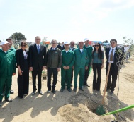 President Ilham Aliyev and family members participate in a tree-planting campaign devoted to the birthday of national leader Heydar Aliyev