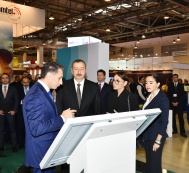 President Ilham Aliyev and First Lady Mehriban Aliyeva familiarize themselves with “BakuTel-2017” Exhibition
