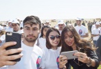 President Ilham Aliyev and family members participate in a tree-planting action dedicated to the anniversary of national leader Heydar Aliyev